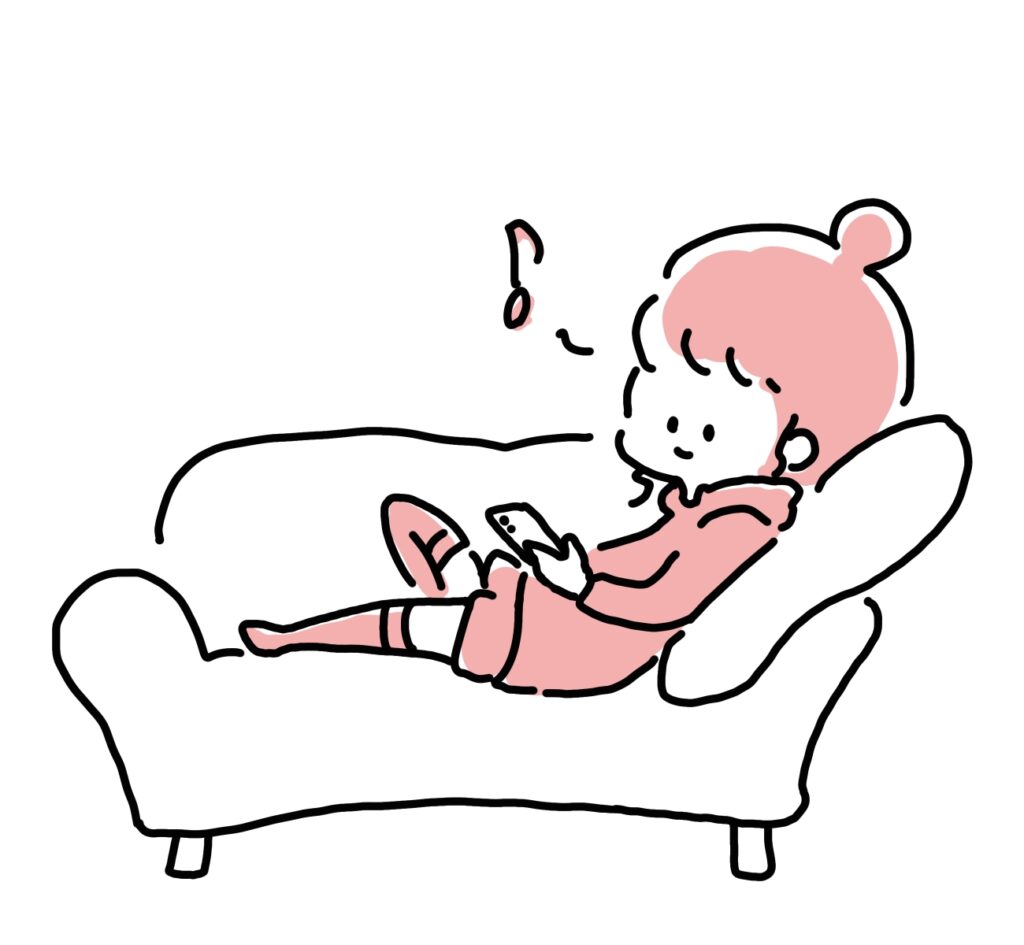 ソファでくつろぎながらアニメを見る人